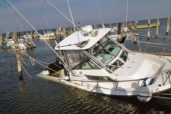 The best defense against a dock side sinking is to check on your vessel often, and ensure that cockpit drains are kept clear of debris.